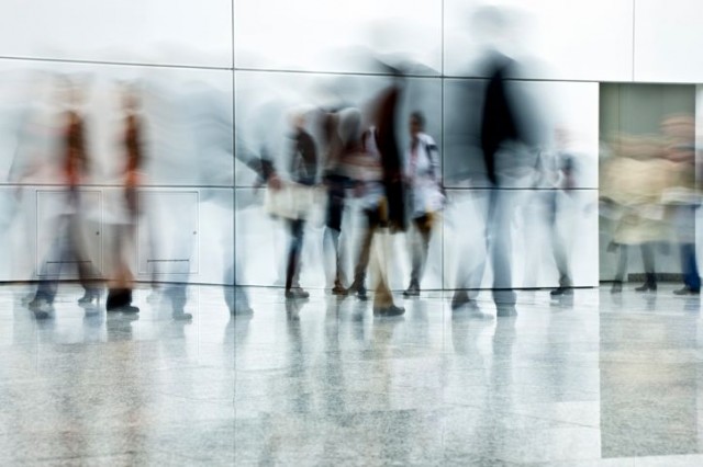 Blurred People Walking in a Modern Interior