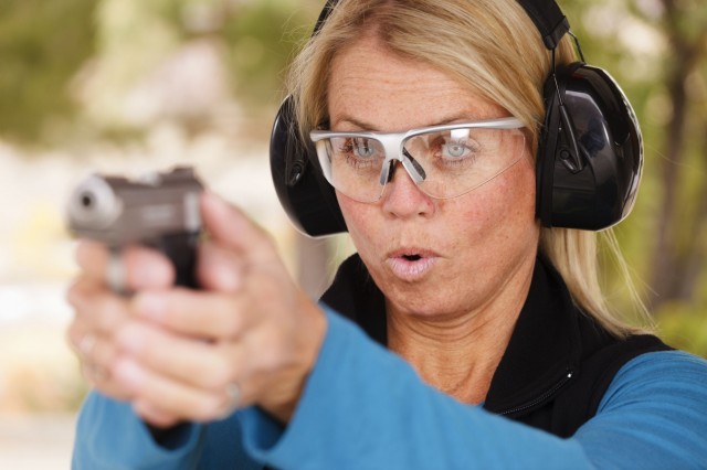 Woman Pointing a Gun